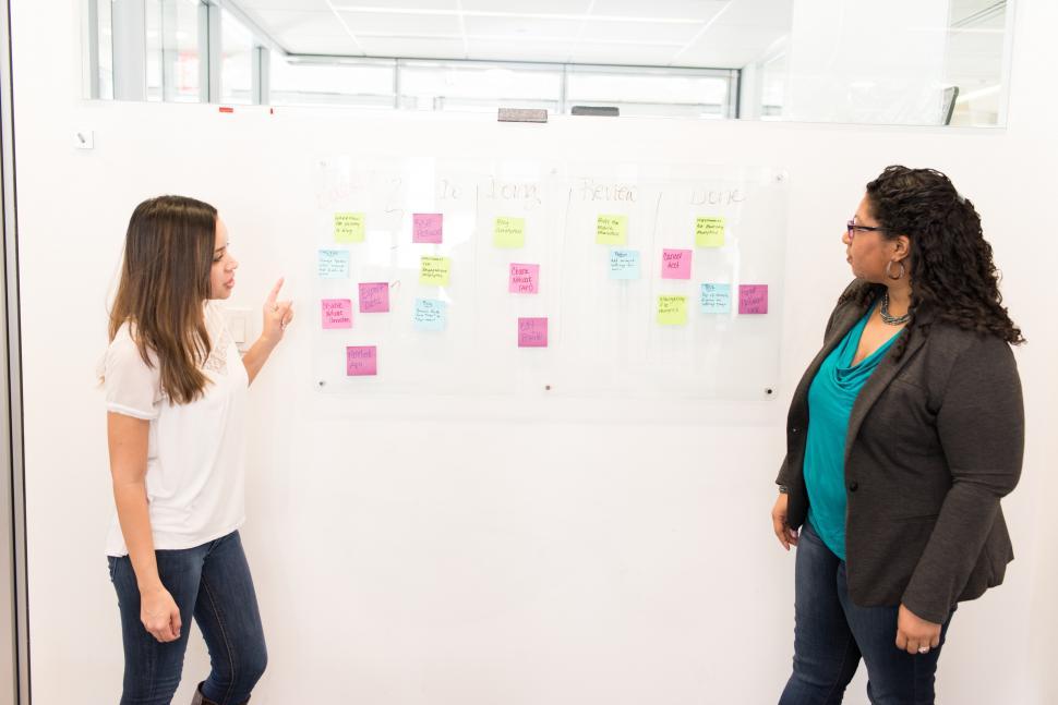 Free Image of Two business women with whiteboard 