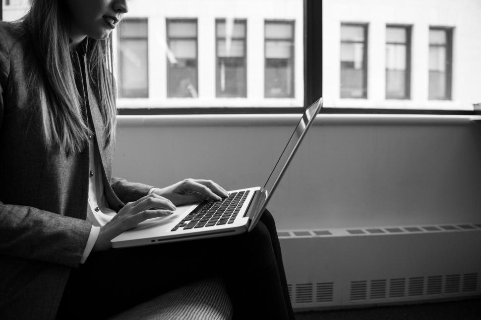 Free Image of Woman typing on laptop - looking down 