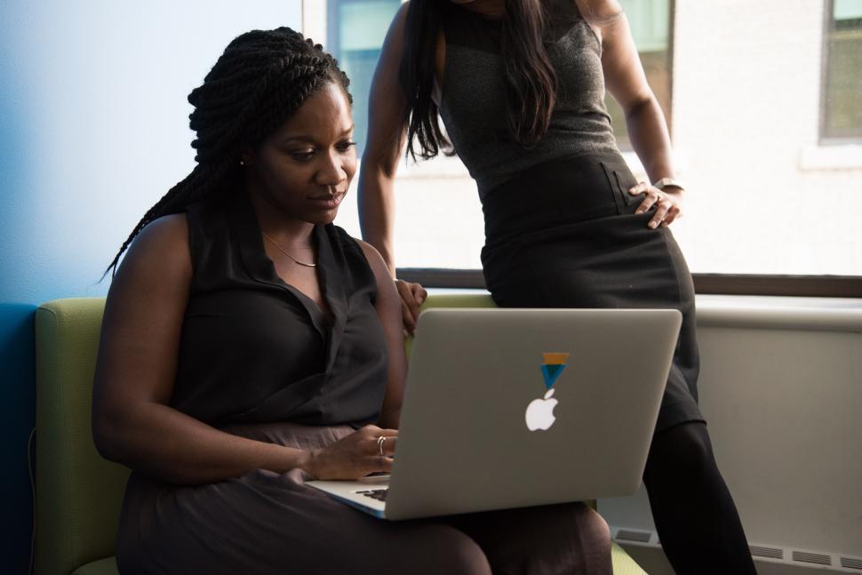 Free Image of Two business women with laptop in office 