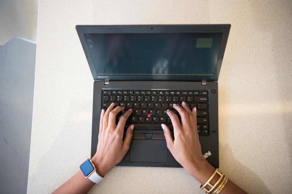 Free Image of Hands typing on laptop keyboard 