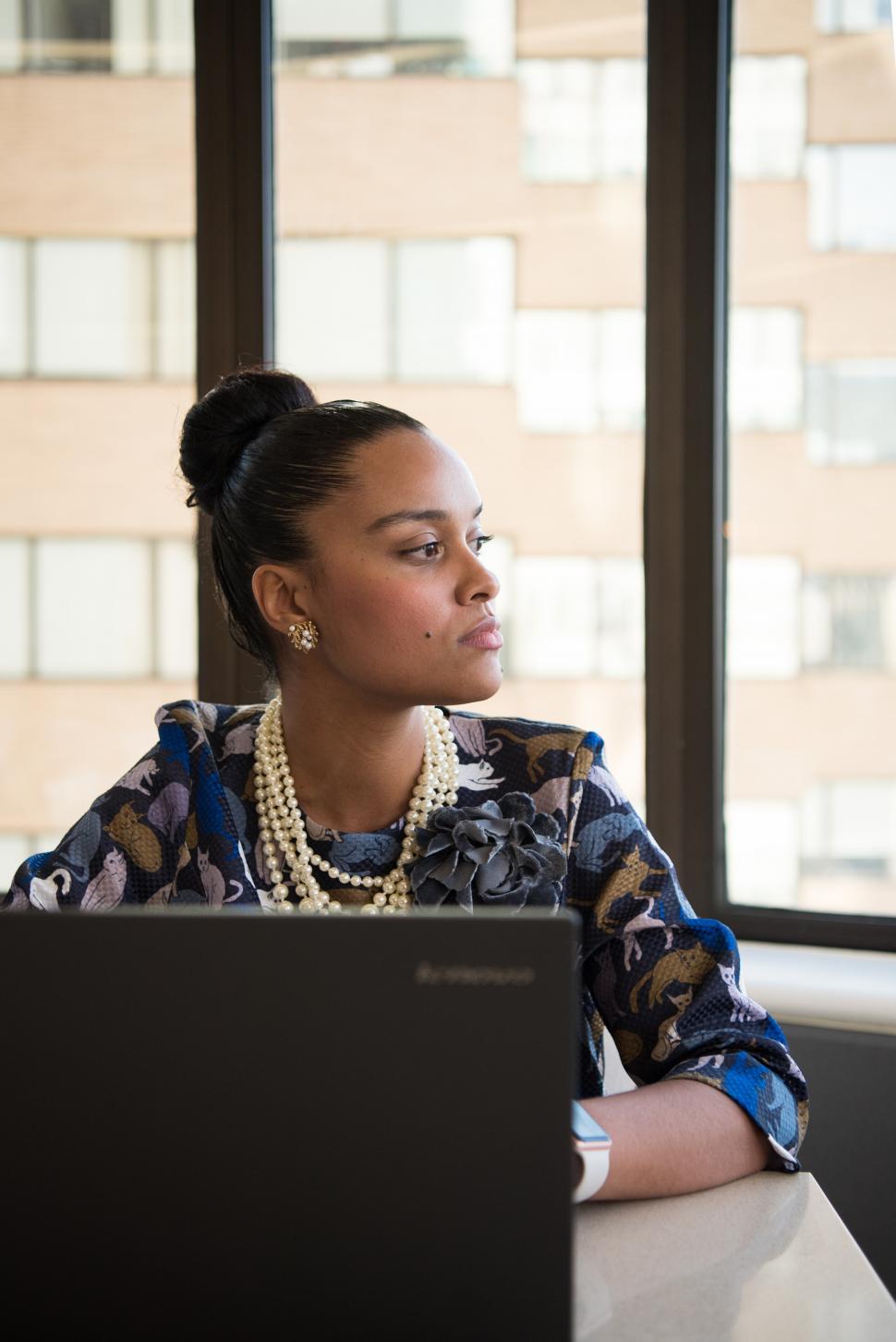 Free Image of Businesswoman with laptop in office - looking away 