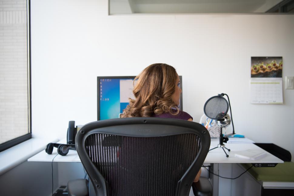 Free Image of Businesswoman recording her podcast in office 