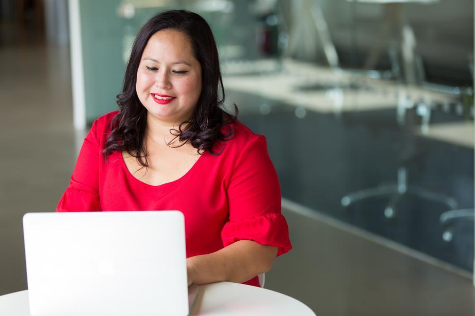 Free Image of Happy Businesswoman with laptop in office 