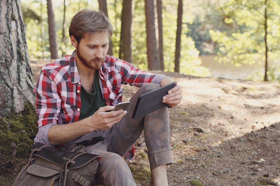 Free Image of Man in the woods with devices 