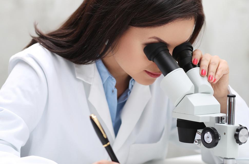 Free Image of Lab tech with Microscope 