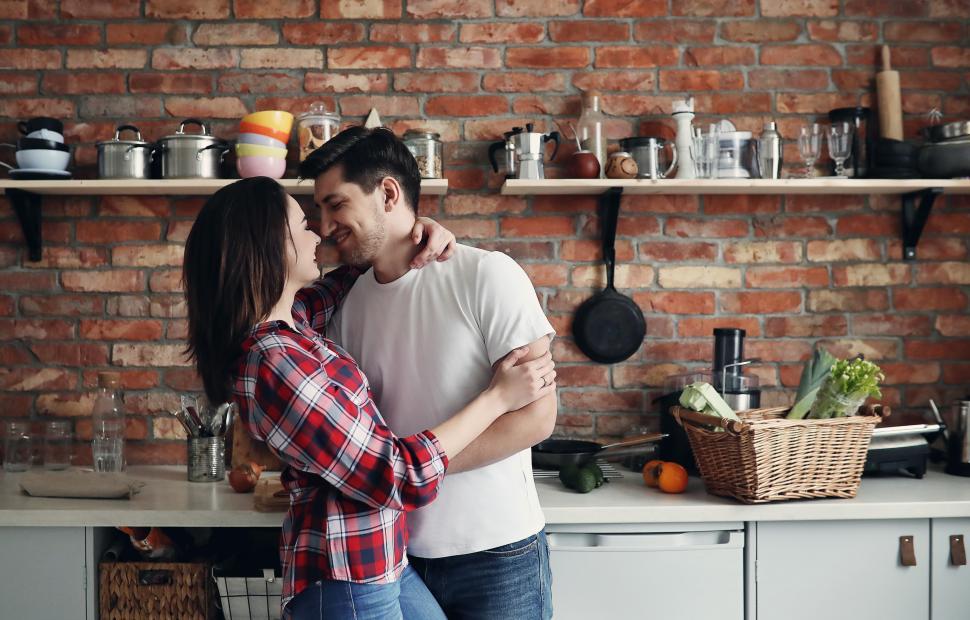 Free Image of Happy couple together in the kitchen 