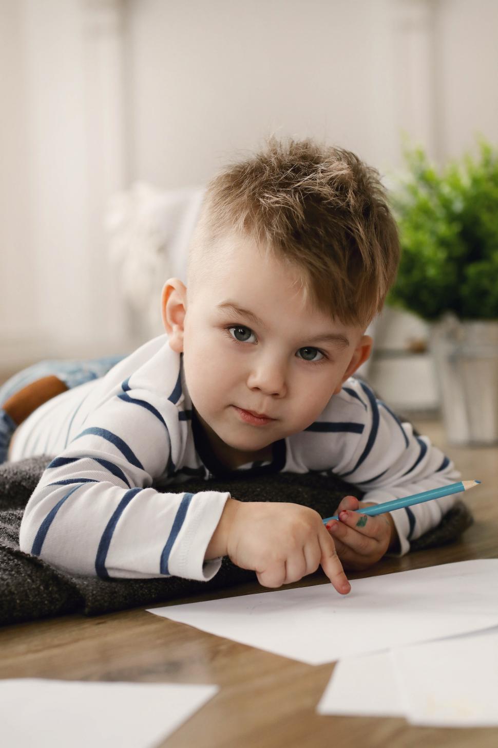 Free Image of Toddler at home drawing 