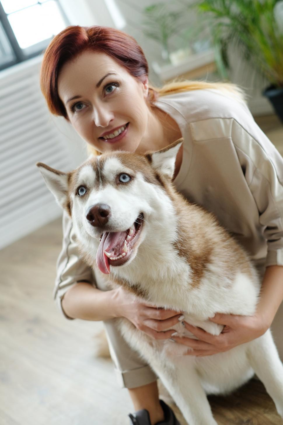 Free Image of Woman with her husky dog 
