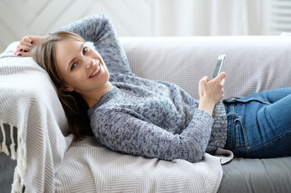 Free Image of Happy woman relaxing at home 