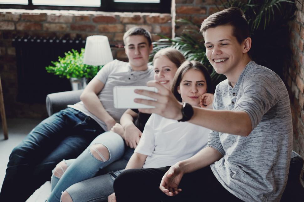 Free Image of Teenagers take a group selfie 