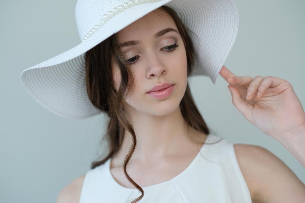 Free Image of Woman in white hat 