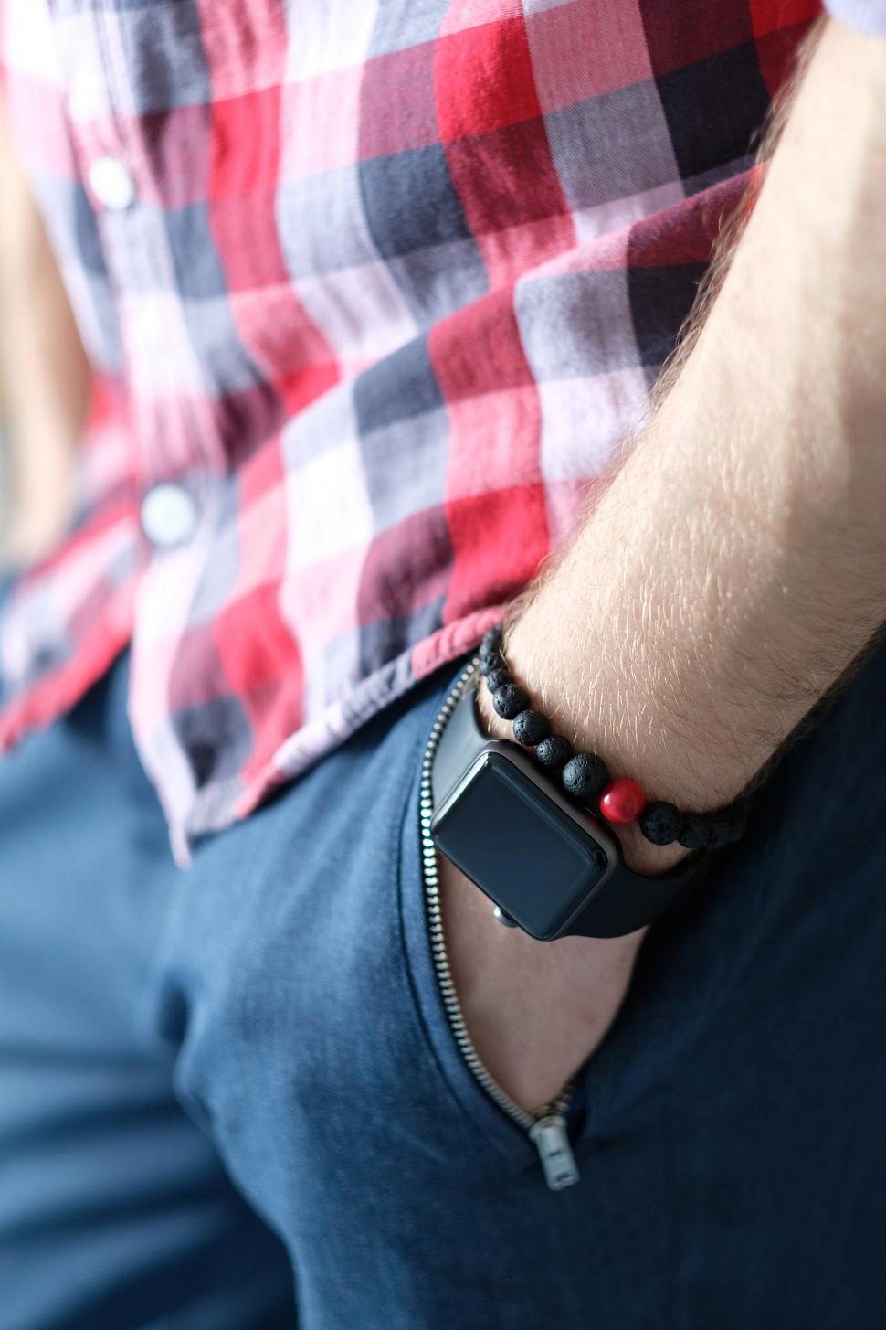 Free Image of Watch on hand in pocket. Smartwatch. 