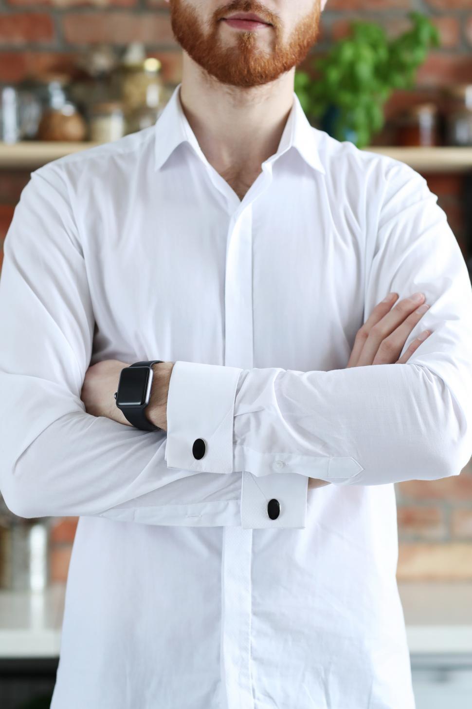 Free Image of Man in white shirt with arms crossed 