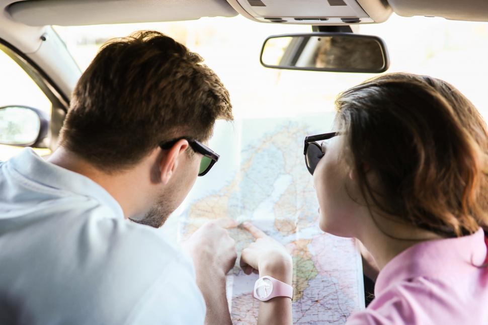 Free Image of Paper map in the car 
