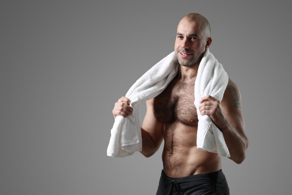 Free Image of Happy bodybuilder with towel 