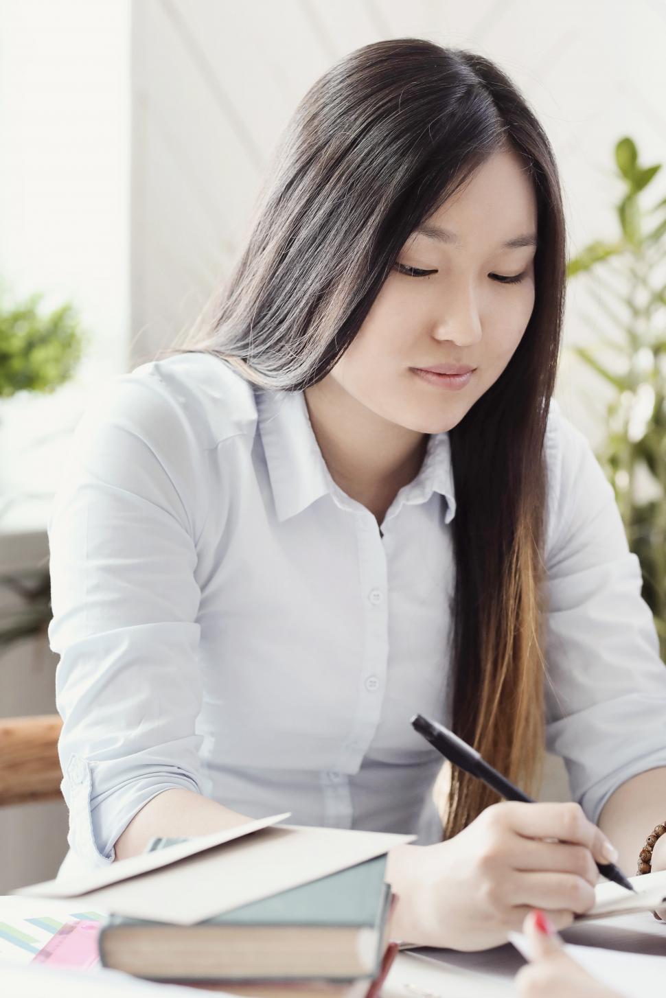 Free Image of Woman taking notes 