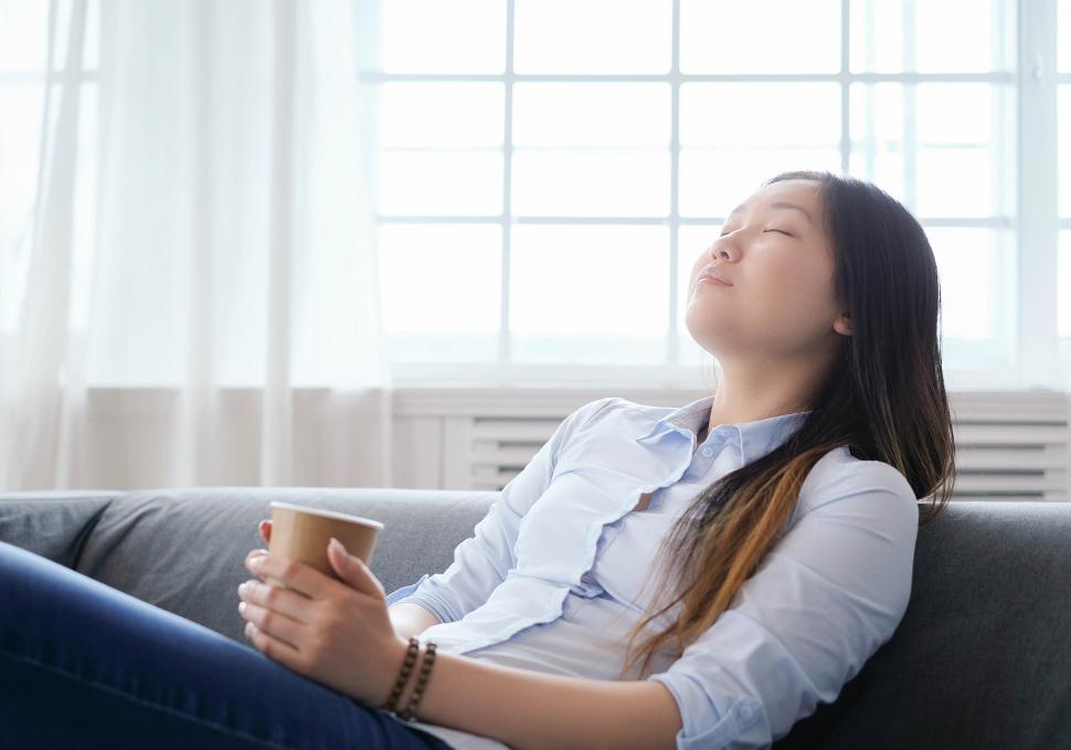 Free Image of Woman relaxing with cup of coffee 