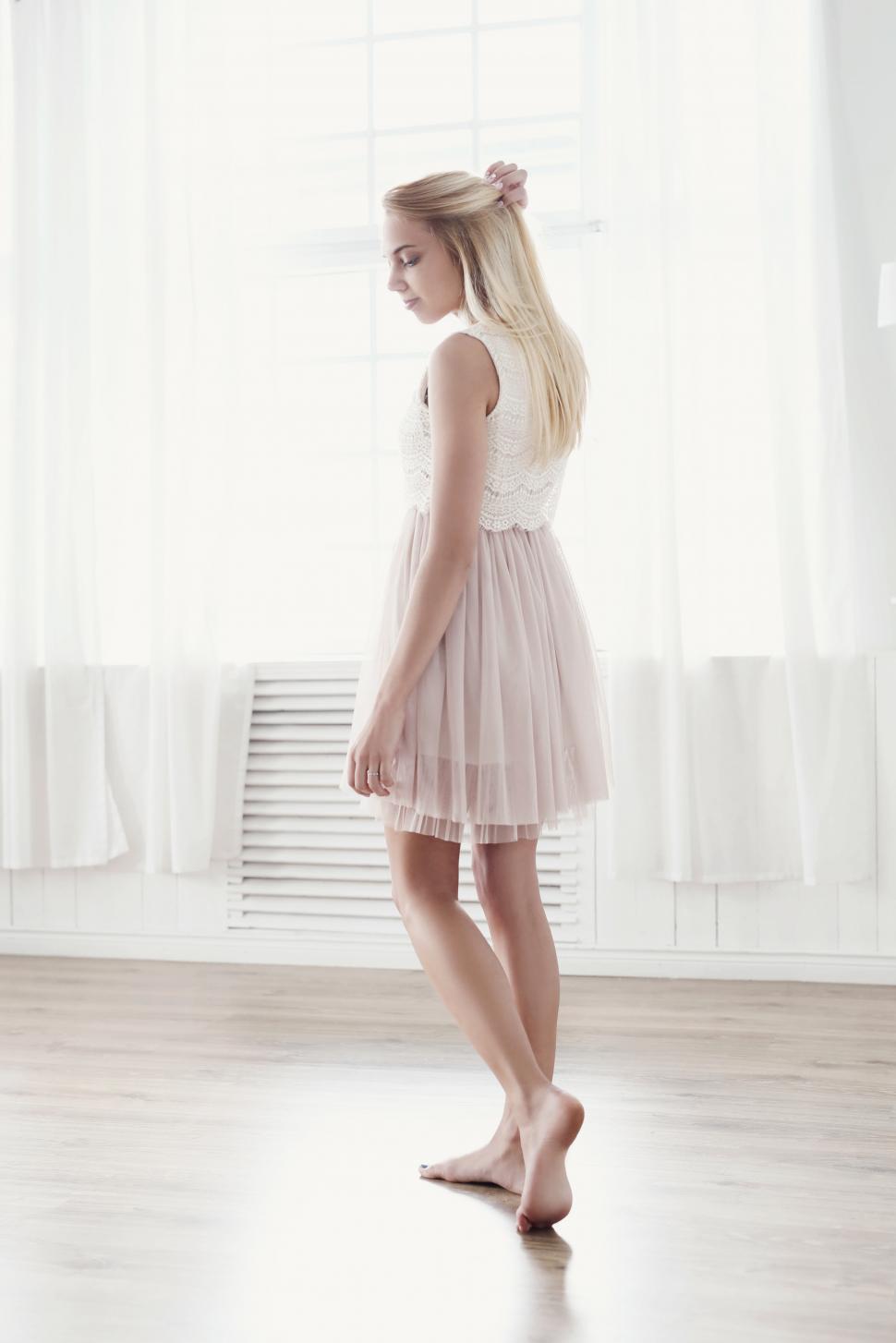 Free Image of Young woman standing in a room 