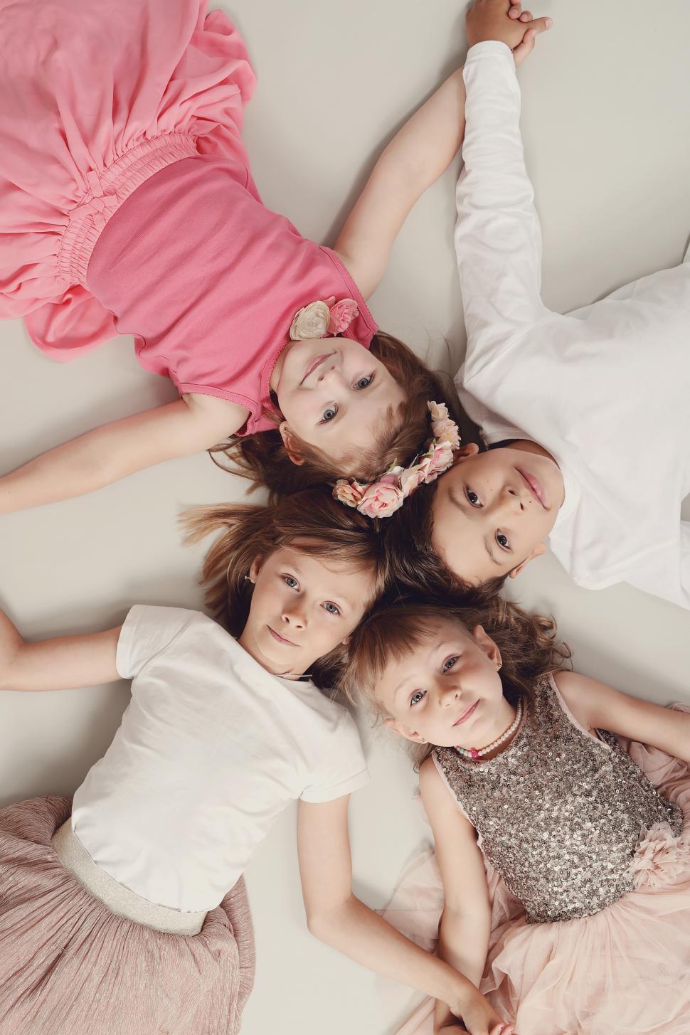 Free Image of Group of kids looking up from the floor 