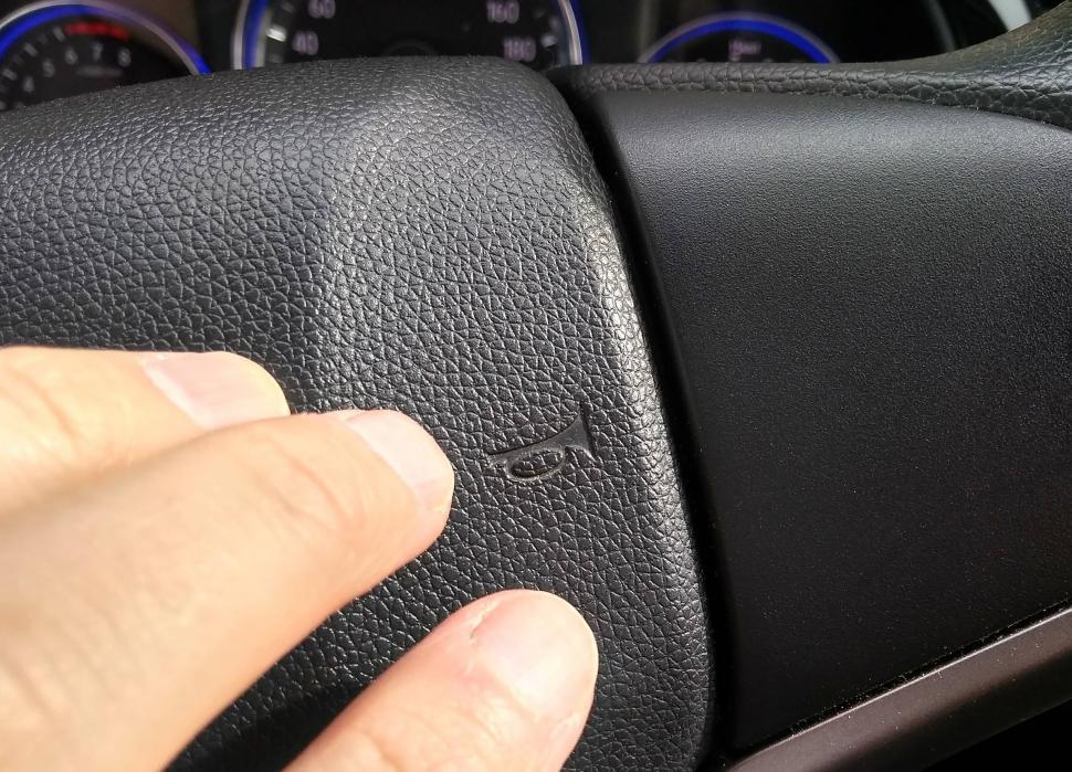Free Image of Hand hits car horn  