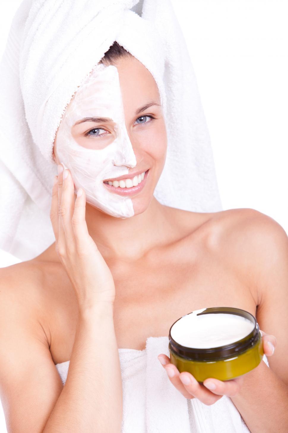 Free Image of Happy woman in towel with facial mask 