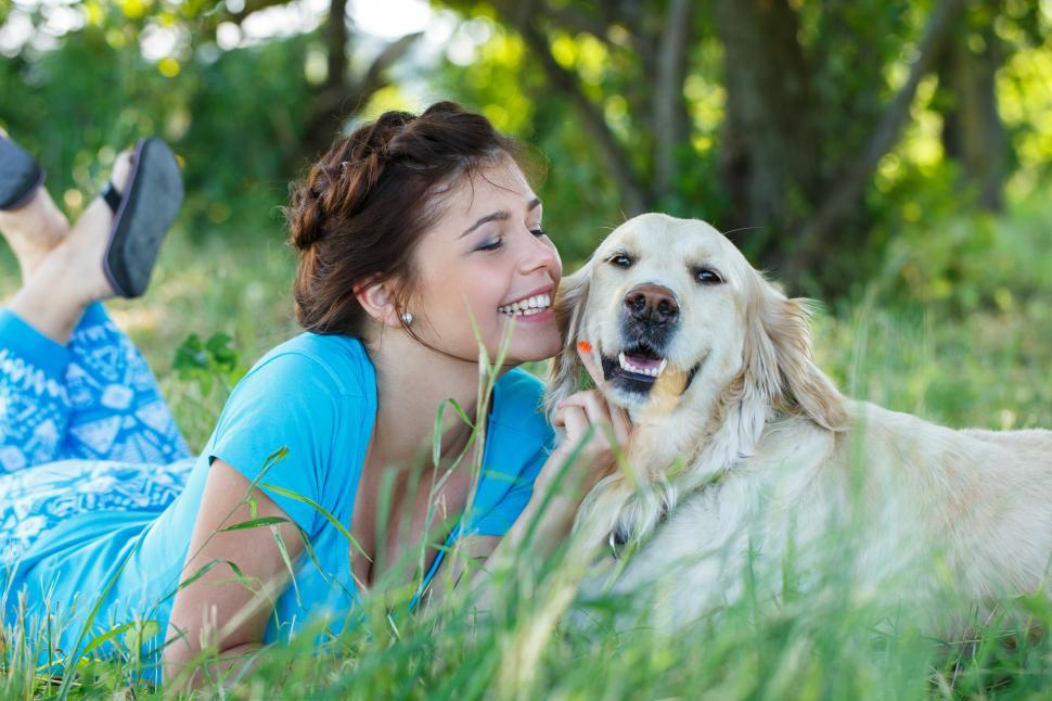 Free Image of Young woman outdoors with dog 
