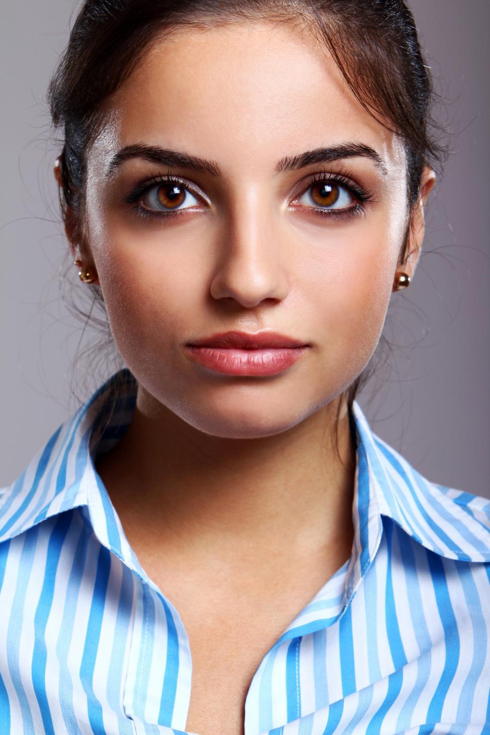 Free Image of Portrait of young woman in striped blouse 