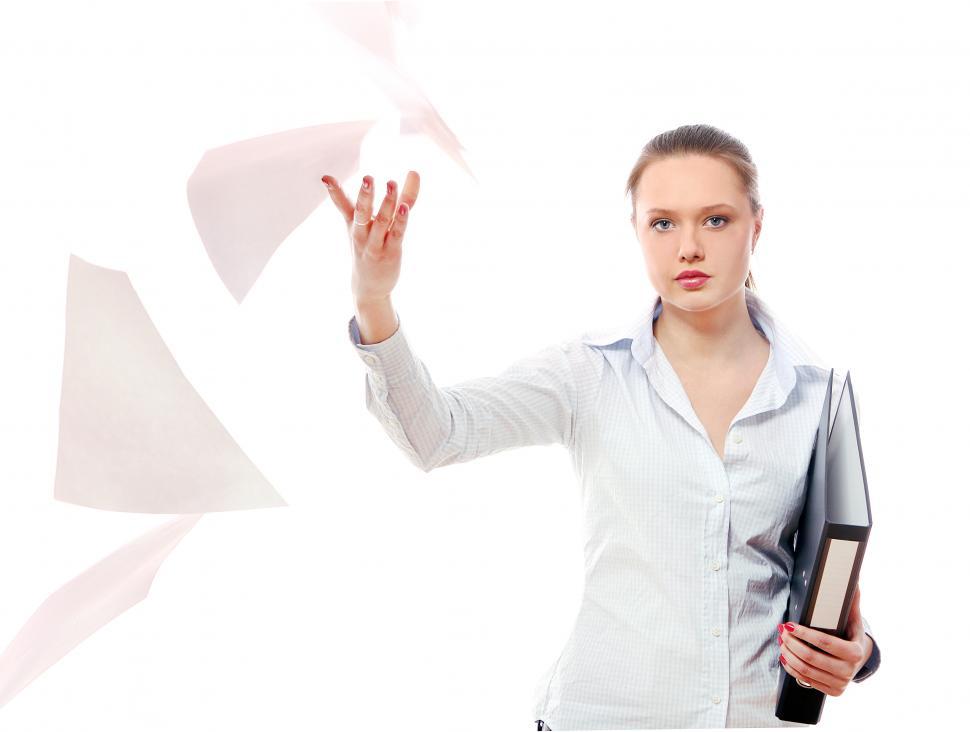 Free Image of Young business woman with flying papers 
