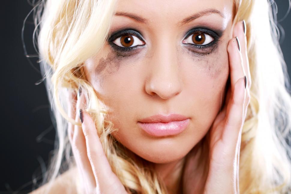 Free Image of Young woman with running mascara 