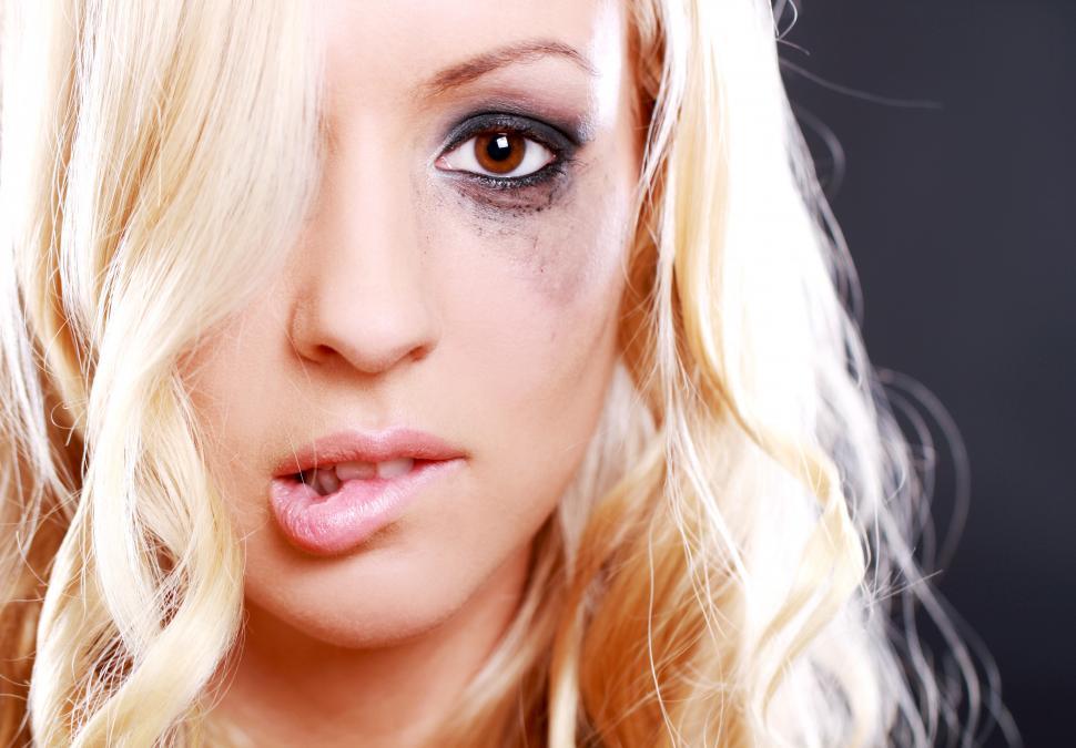 Free Image of Young woman with smudged makeup 