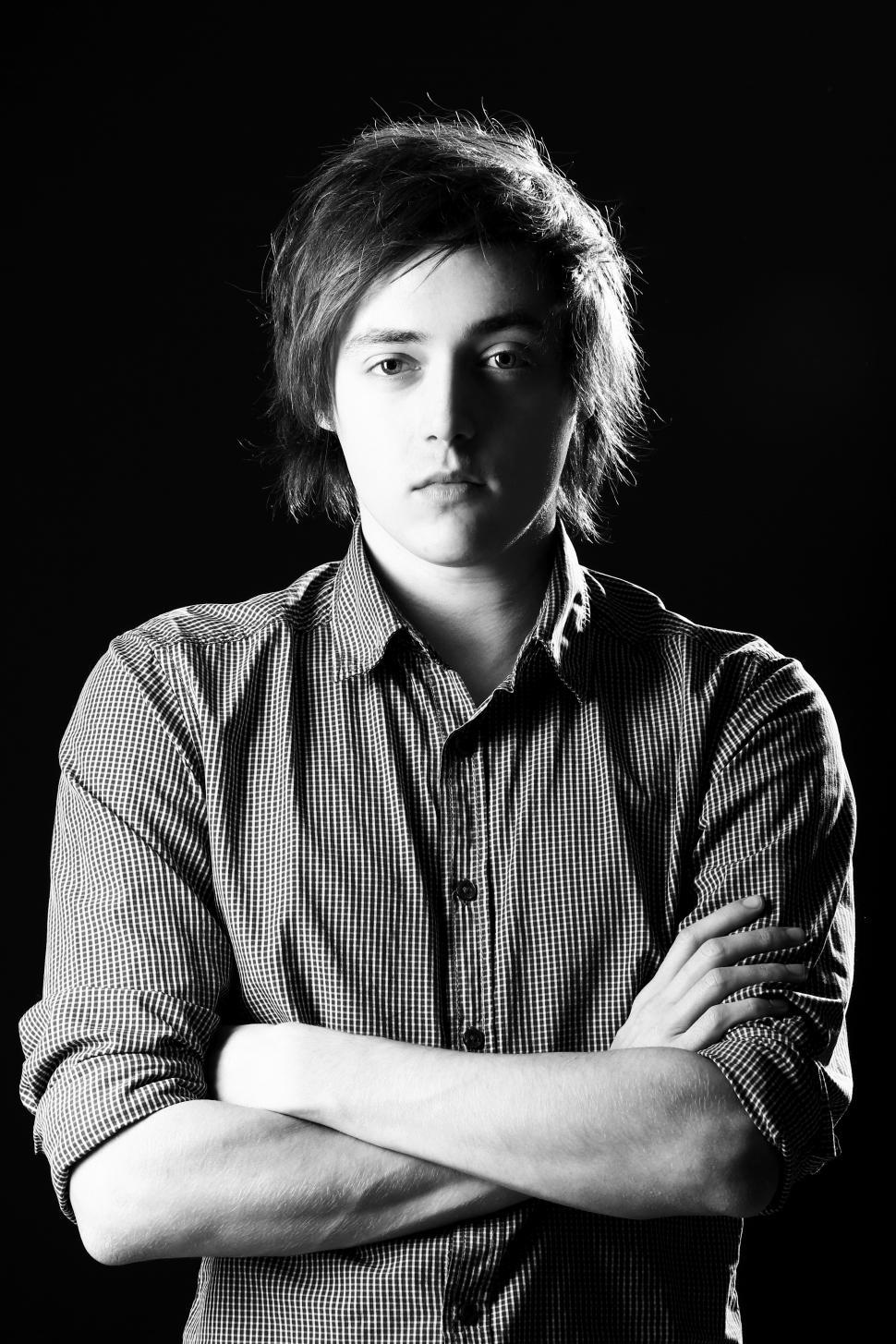 Free Image of Young guy, black and white, over black background 