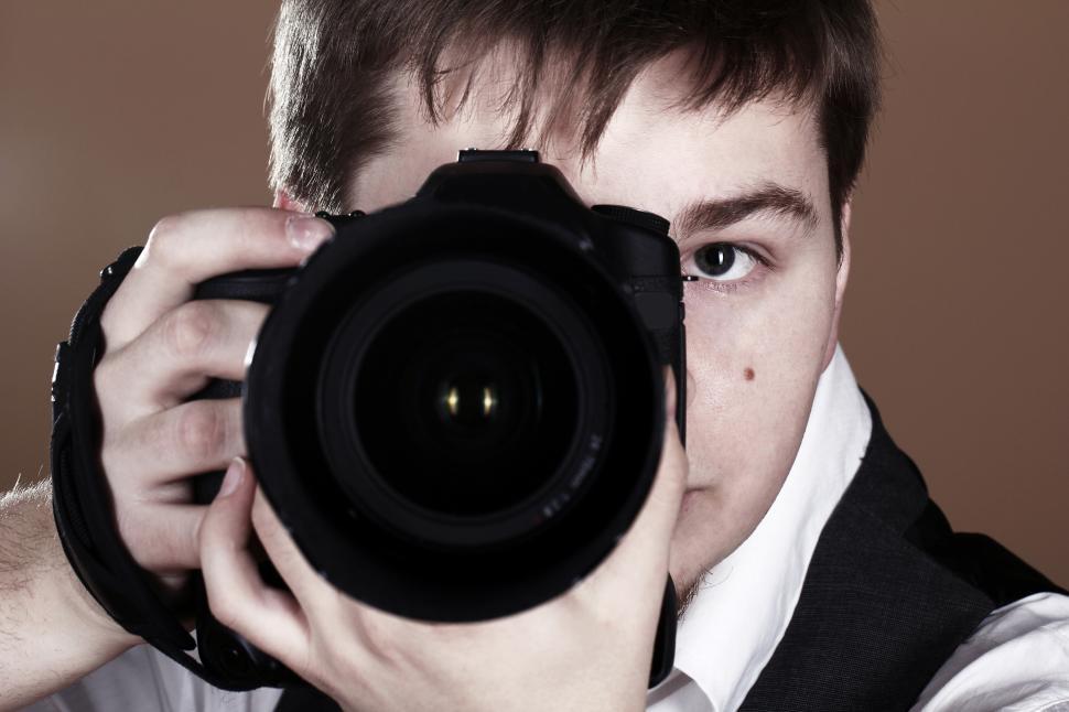 Free Image of Close up of photographer with camera 