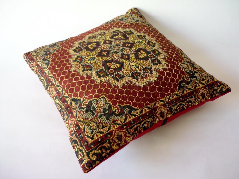 Free Image of Square Pillow With Red and Black Pattern 