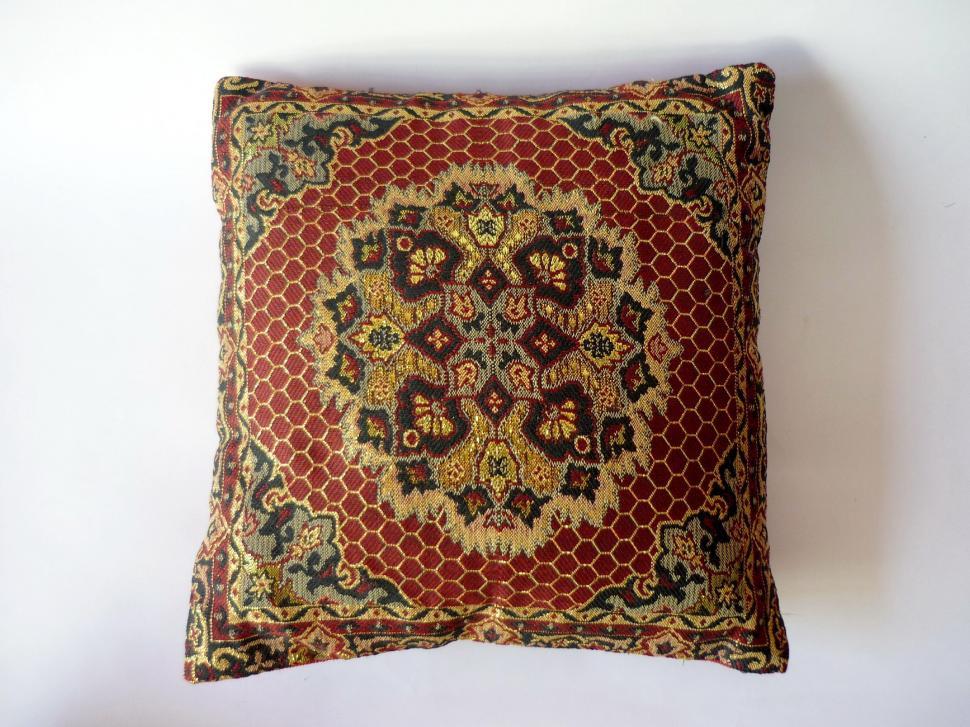 Free Image of Stylish Decorative Pillow With Red and Gold Pattern 