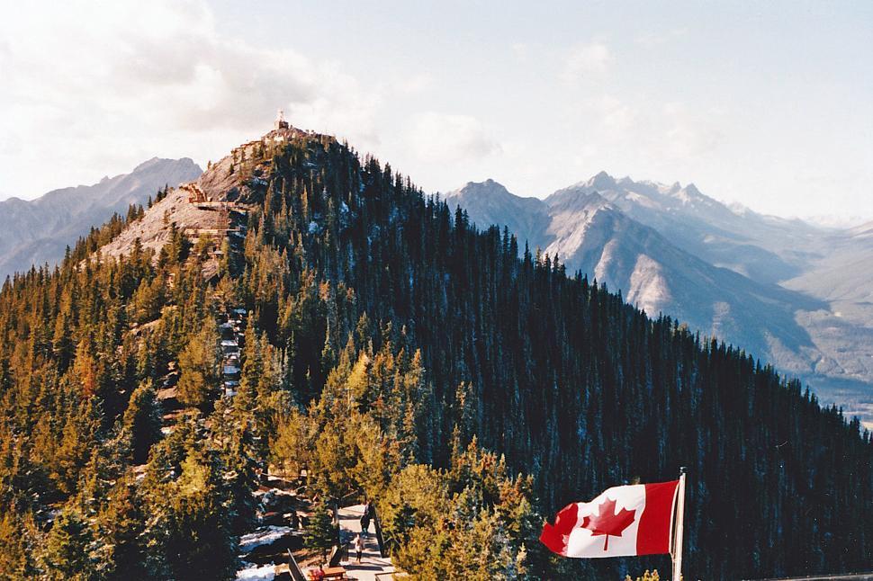 Free Image of Canadian Flag Atop Sulphur Mountain 