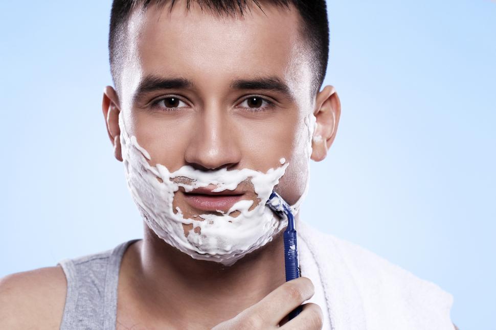Free Image of Man shaving with razor 