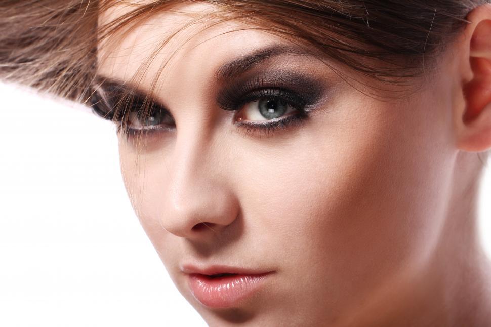 Free Image of Close up of young woman with blue eyes 