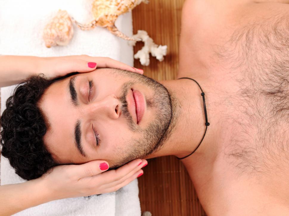 Download Free Stock Photo of Handsome guy enjoying massage therapy 