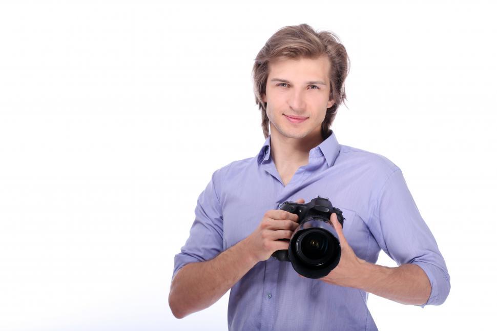 Download Free Stock Photo of Young man with DSLR camera 