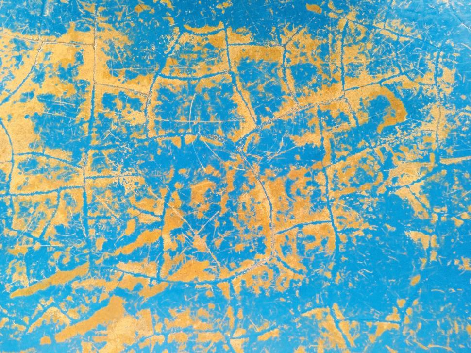 Free Image of Fractured blue and orange concrete texture  