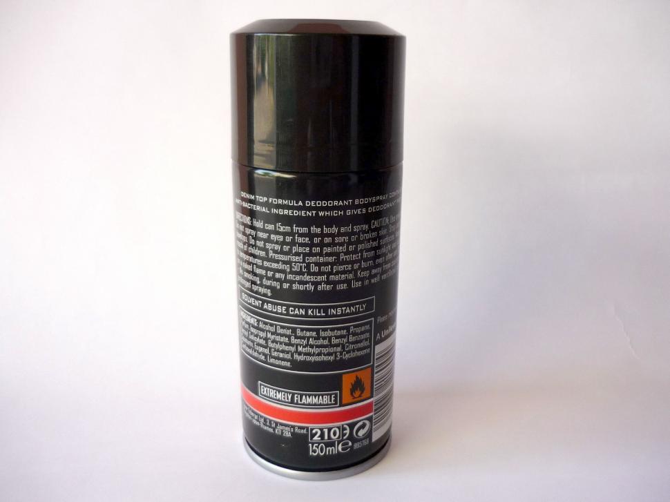 Free Image of Can of Black Spray Paint on White Background 