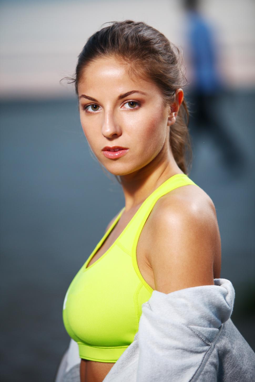 Free Image of Woman standing in workout gear 