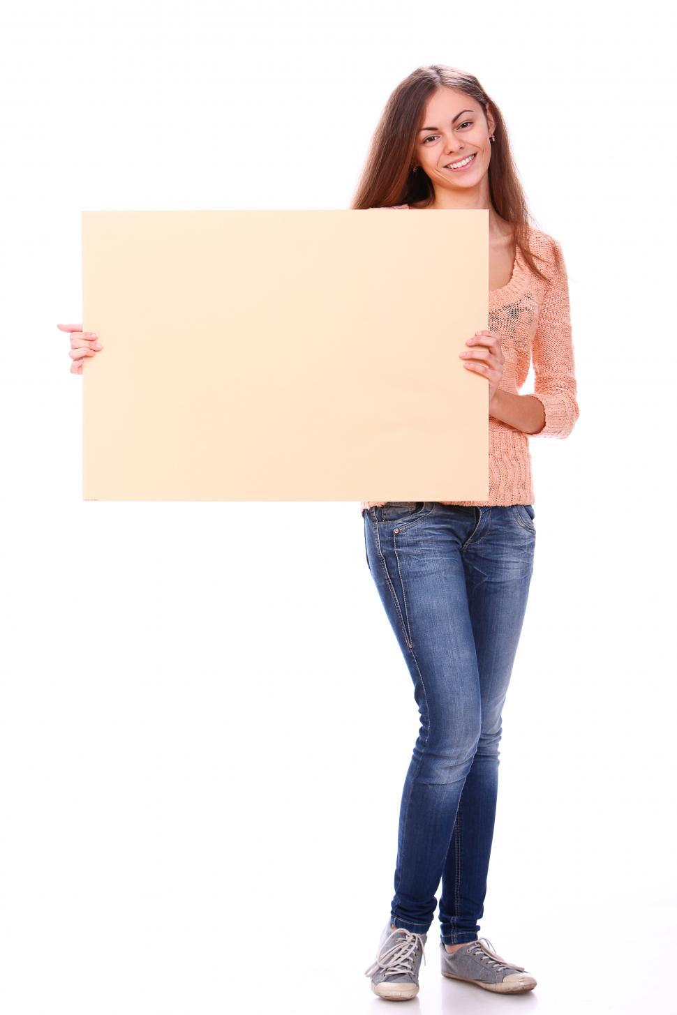 Free Image of Young woman with big blank sign 