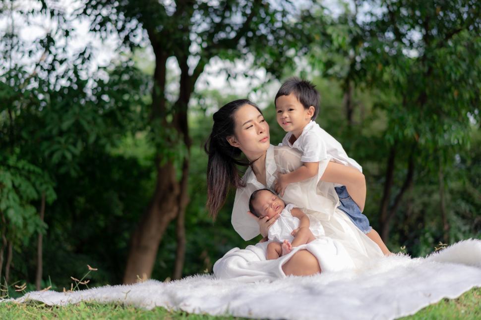Free Image of Asian young beautiful mother holding her newborn 
