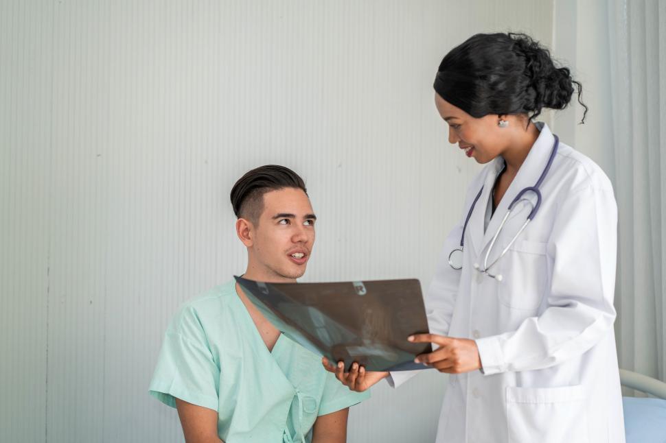 Free Image of woman doctor talking and explain to a patient  
