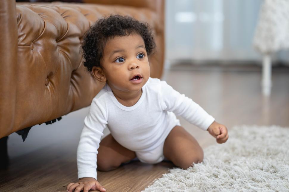 Download Free Stock Photo of Cute African American baby boy crawling 