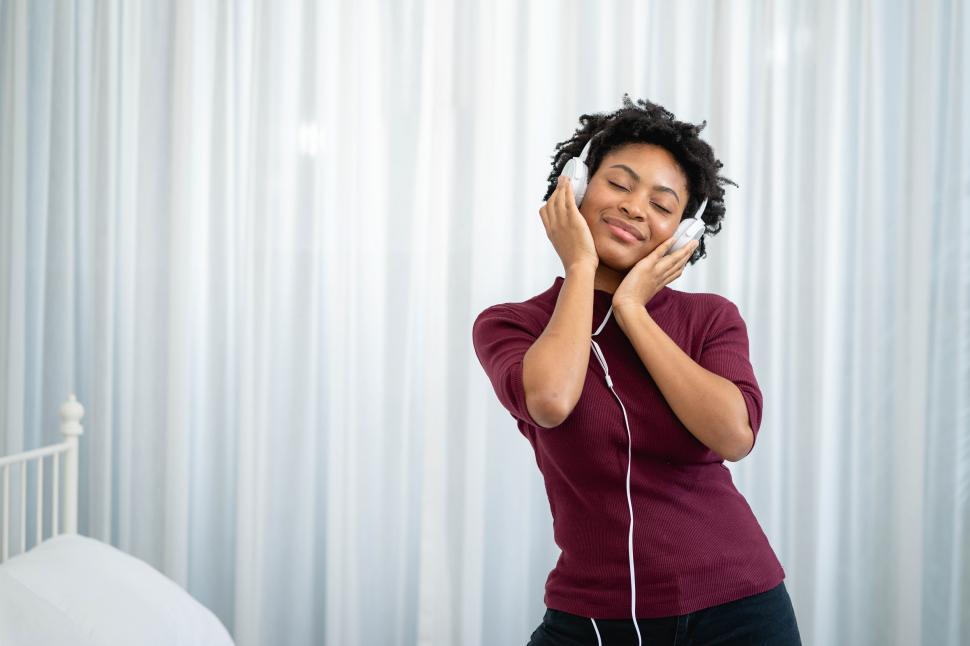 Free Image of African american woman listening music 