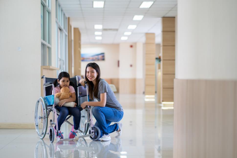 Free Image of asian girl sitting on wheelchair 
