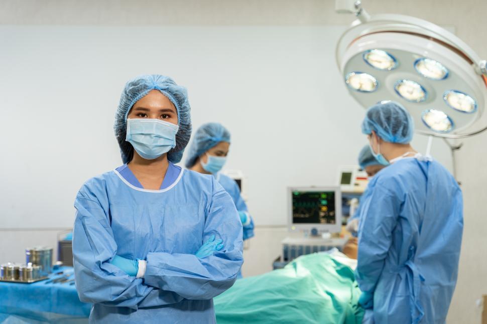 Download Free Stock Photo of Woman and Surgical Team 