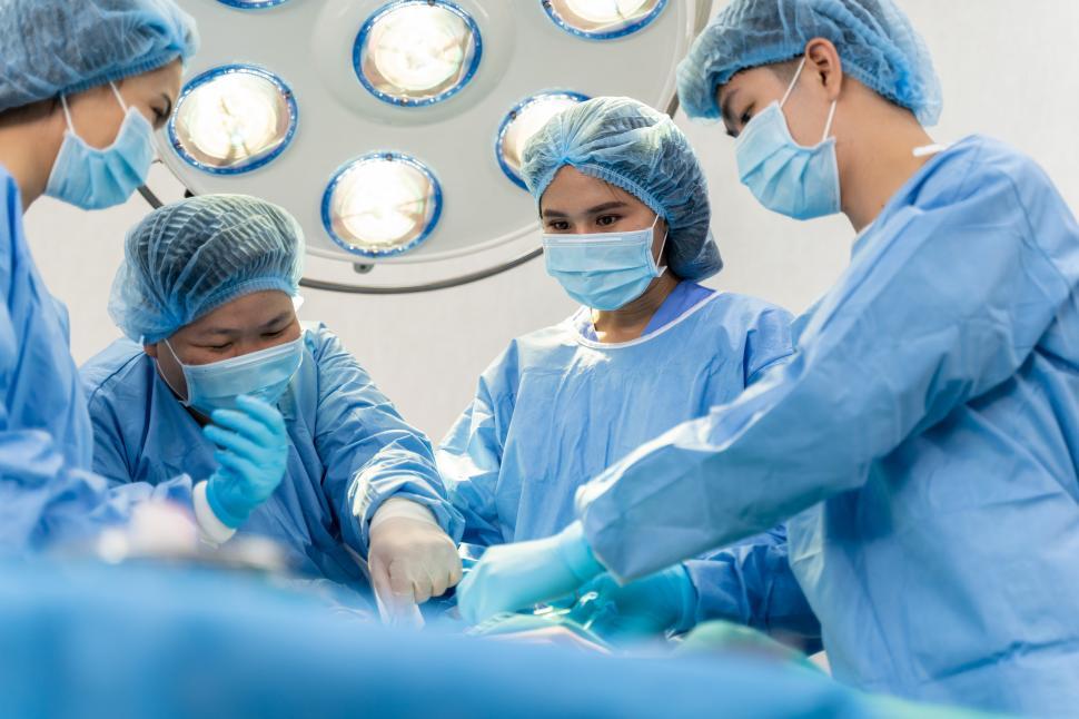 Download Free Stock Photo of Medical Team Performing Surgical Operation 